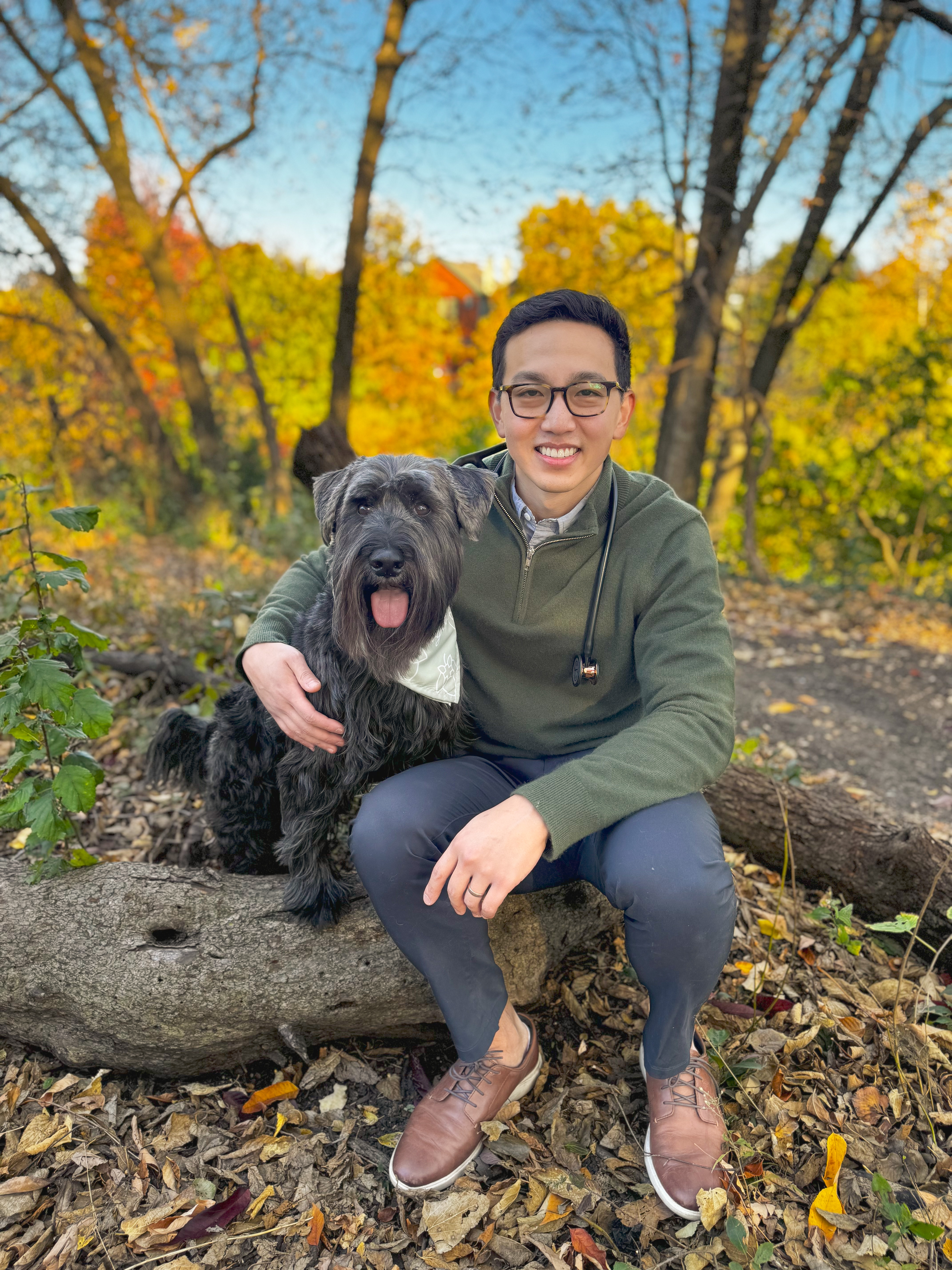 picture of veterinarian Doctor Andrew Lee with his black Schnauzer named Sawyer